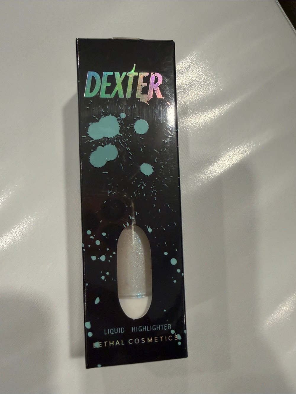 Dexter Liquid Highlighter - Teal Accent Holographic Logo